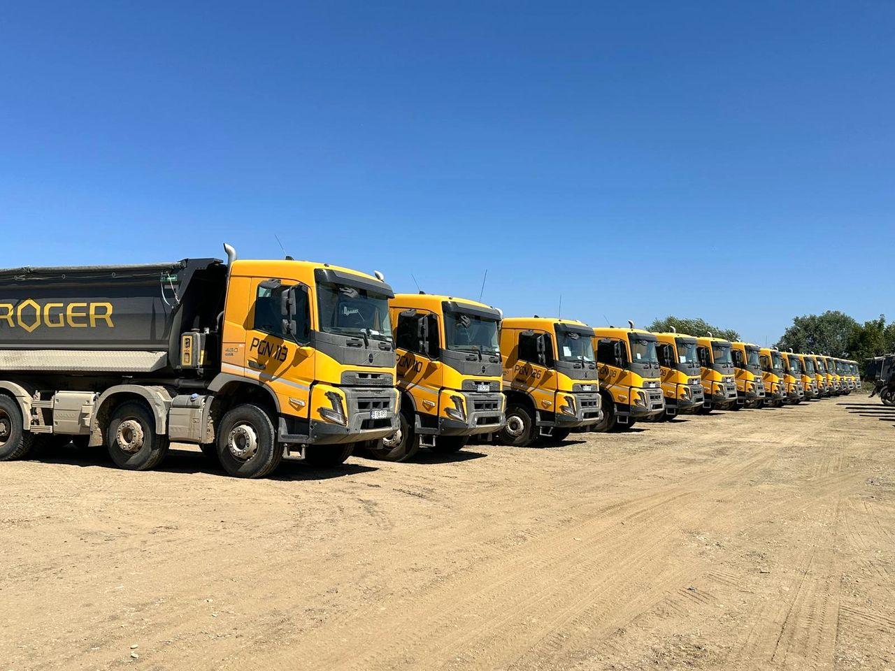 Row of Proger tipper trucks from the company's own transport fleet