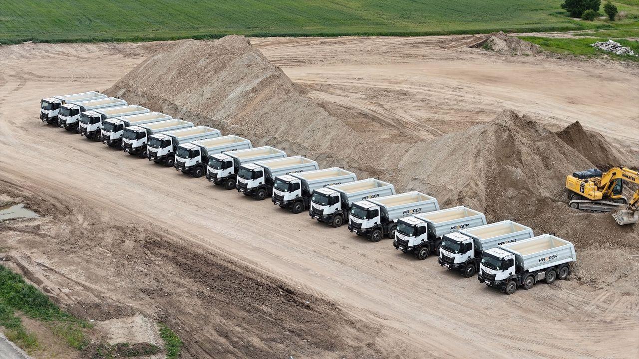 Aerial view of Proger tipper trucks lined up on an earthworks site